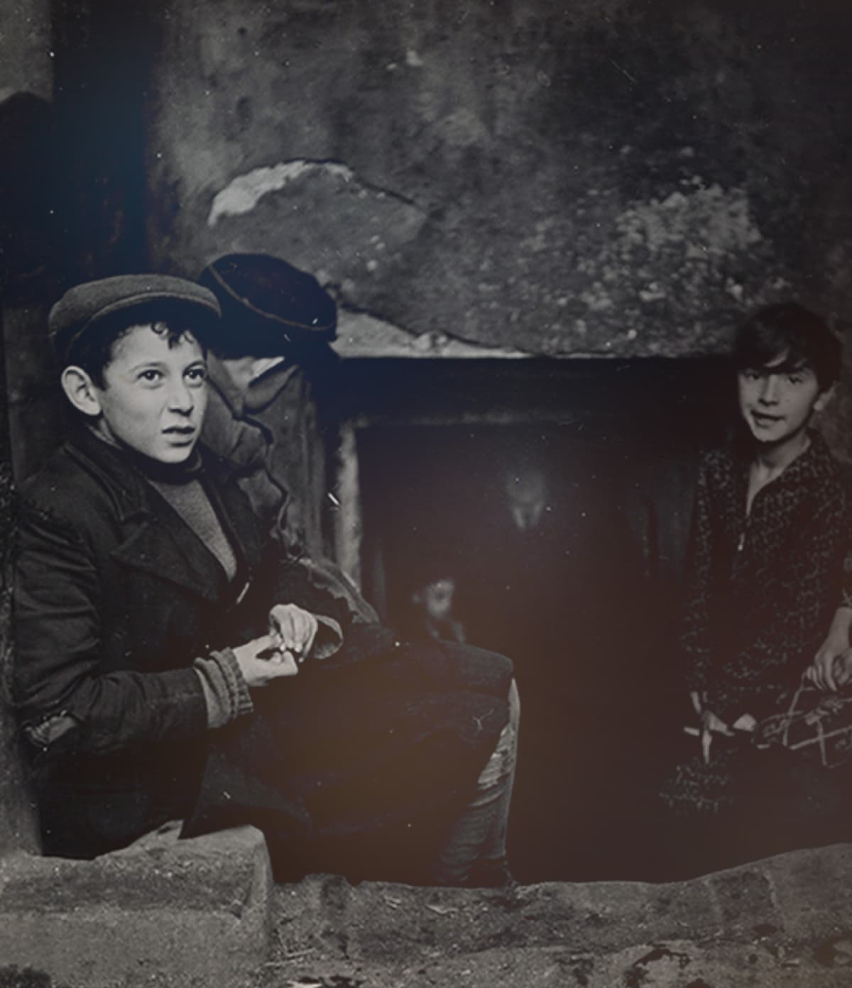 Children seeking light and air outside their basement home Krochmalna Street Warsaw ca 1935 38
